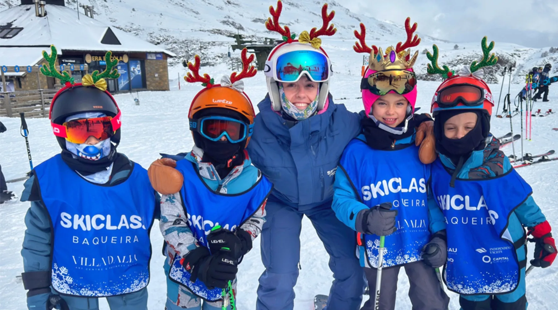 Children from the SkiClass ski course wearing reindeer hats at Christmas in Baqueira
